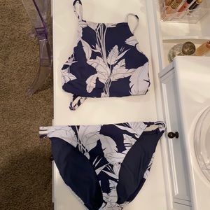 A cute navy blue swimmie with a white leaf design!